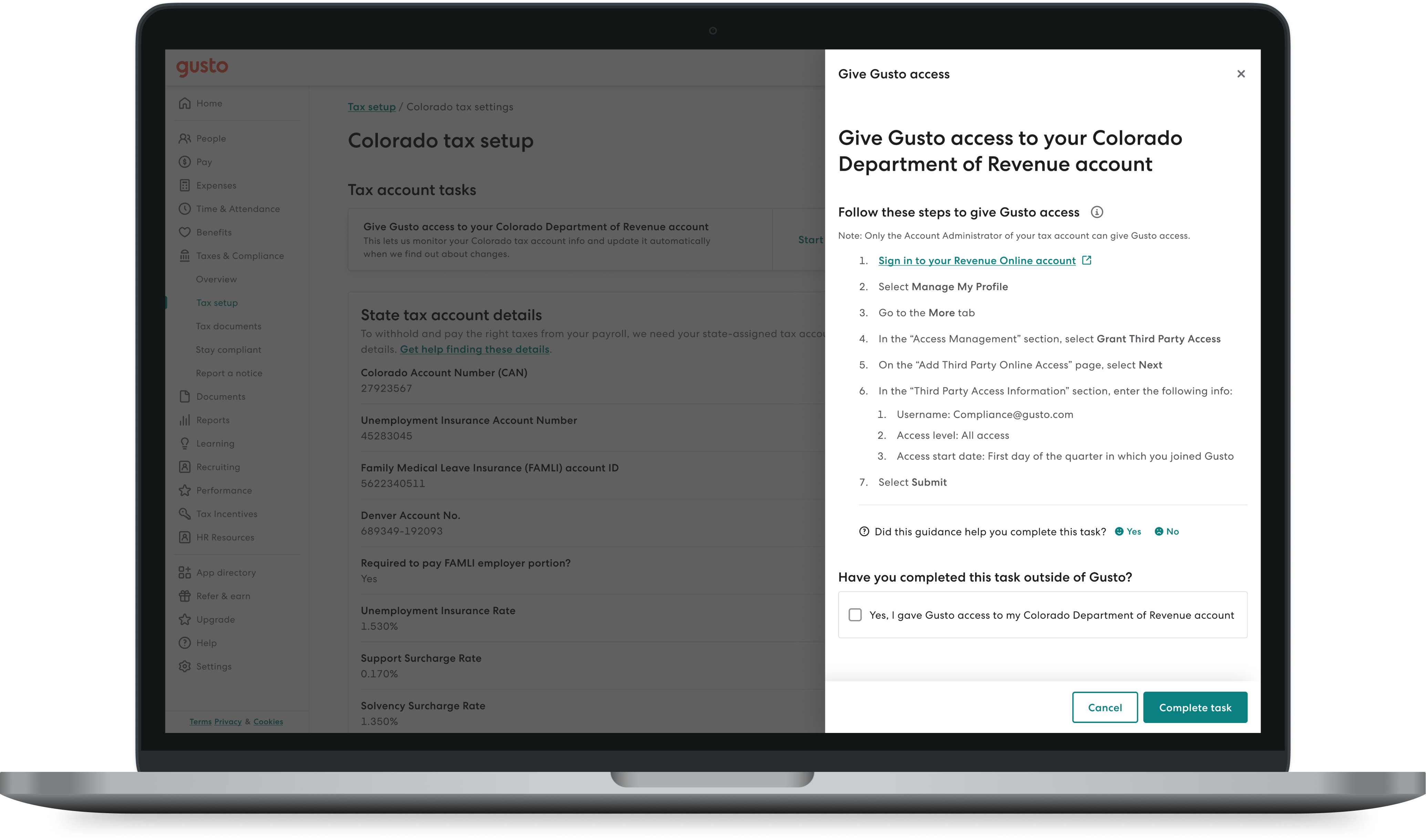 A MacBook showing a page with state tax account info for Colorado